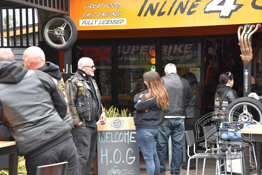 Blackie & Christine have a chat in front of the welcome sign