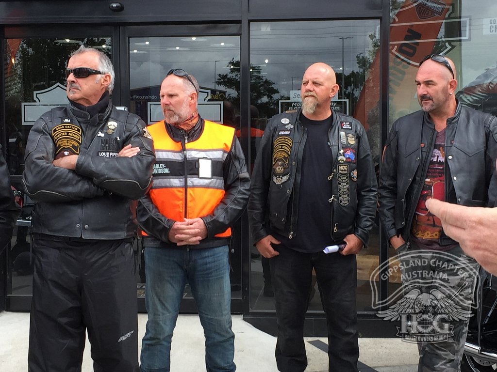 Road Captains Jim, Kim, Andrew & Corey - looking at a bike - what else!